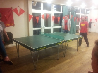 Hotly contested game of table tennis doubles before the Saturday night dinner and social!